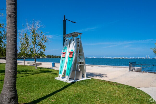 Visitors can grab a paddle board and enjoy the waters at Jose Milton Park.