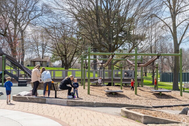 Kids love playing on the vast playground and green space at Spring Rock Park in Western Springs.