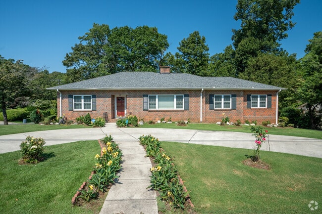 Flowers along the walk way make a beautiful entry to this Ranch Style house in South Roebuck.