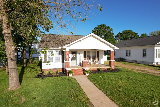A ranch home with brick columns in Car Town.