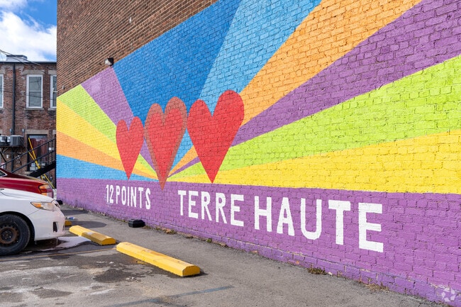The brick buildings of The Avenues are filled with murals depicting community pride.