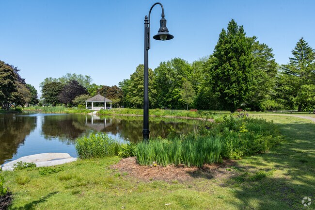 Light posts light the path at night around Mill Creek Park.