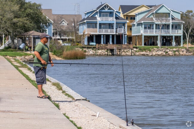 A fisherman casts a line off of the shore in Seabrook, Texas.