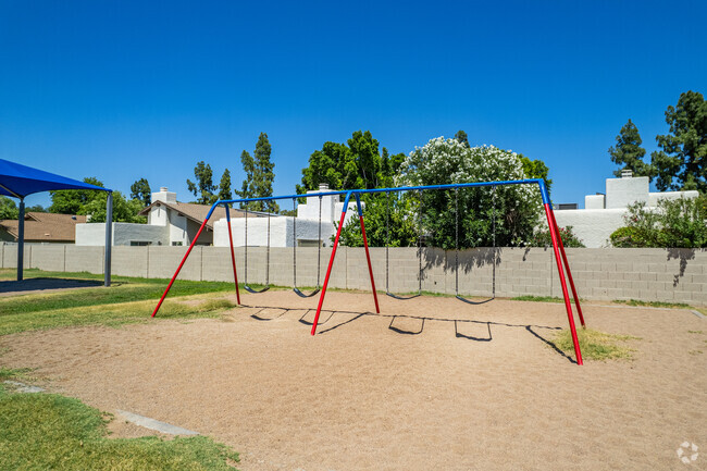 Children enjoy playful moments on the swings at Lakeview Elementary School in Phoenix.