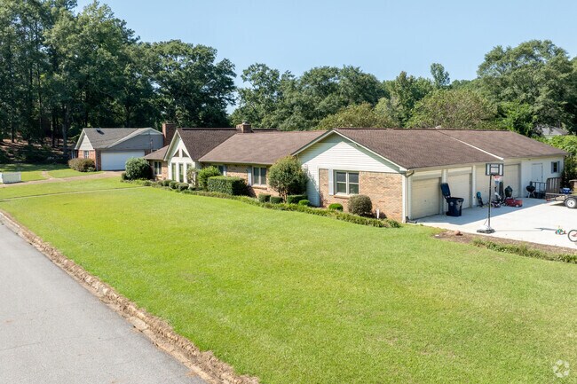 Older homes and beautiful lawns add charm to Northwood Lake.
