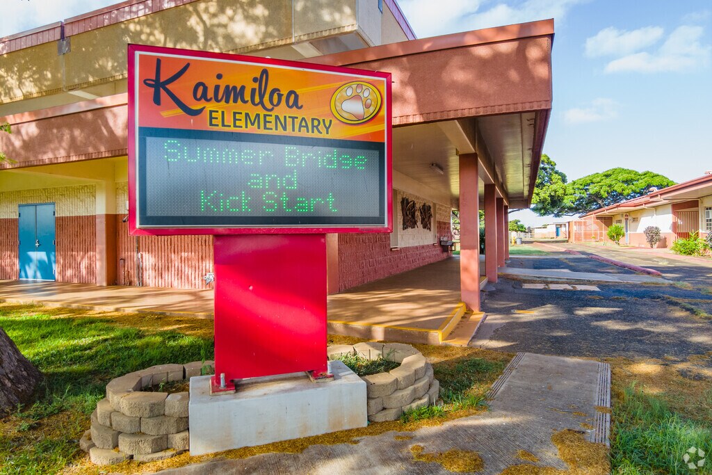 Announcements are broadcast to parents and students outside of Kaimiloa Elementary School.