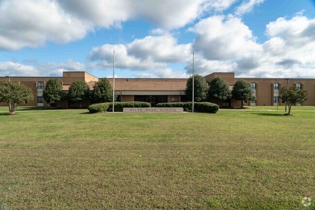 Atlee High School is shown at the end of summer close to fall.