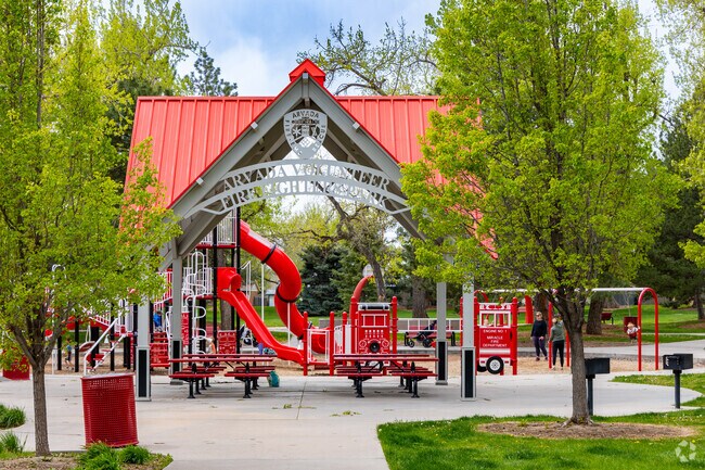 Kids get a thrill from the fire truck-themed playground at Arvada Volunteer Fire Fighters Park.