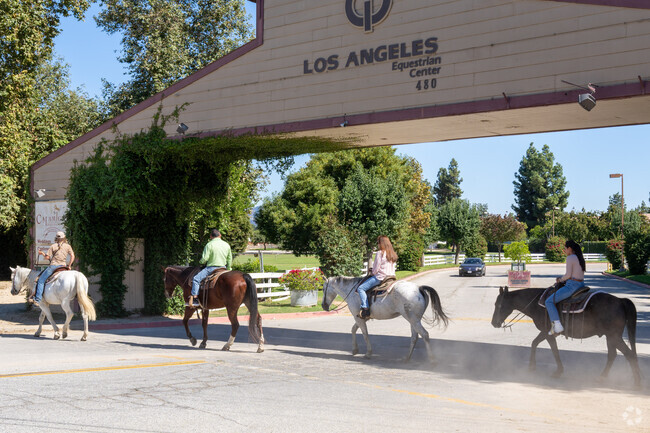Equestrians enjoying horseback riding at the Los Angeles Equestrian Center in Rancho District.