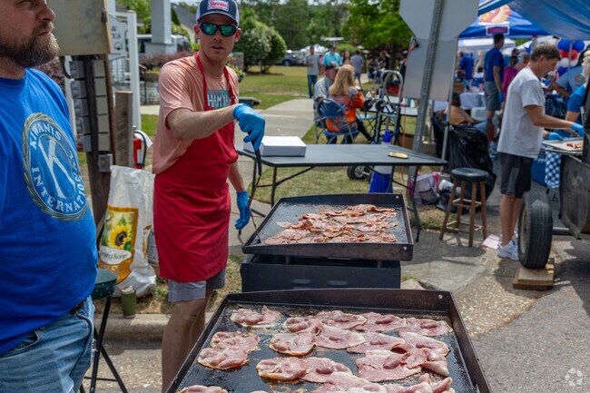 The Kiwanis serve up the finest ham biscuits around at the Smithfield Ham and Yam Festival.