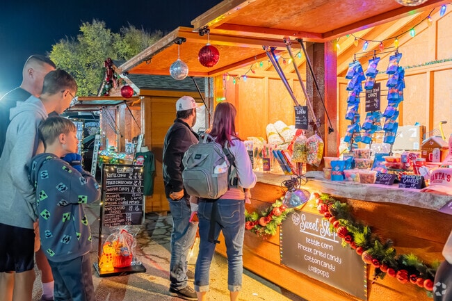 Gooch Acres residents admire decorated Christmas houses with items at Holiday in the Park.