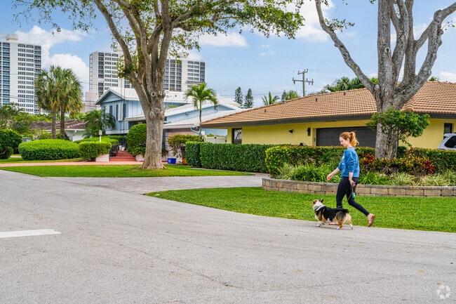 Person walking the dog around Boca Raton neighborhood