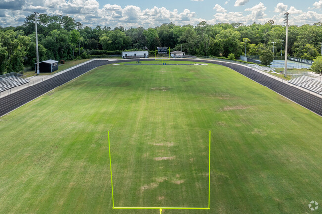 Cheer on the football team at F.W. Buchholz High School.