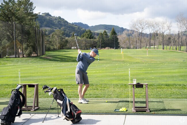 A man practices his driving at the Moraga Country Club, which has an 18-hole golf course set in the hills.