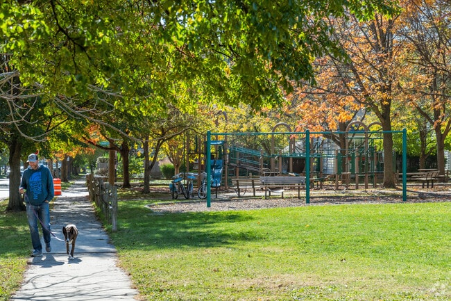 A resident walks their dog alongside Bent Park.