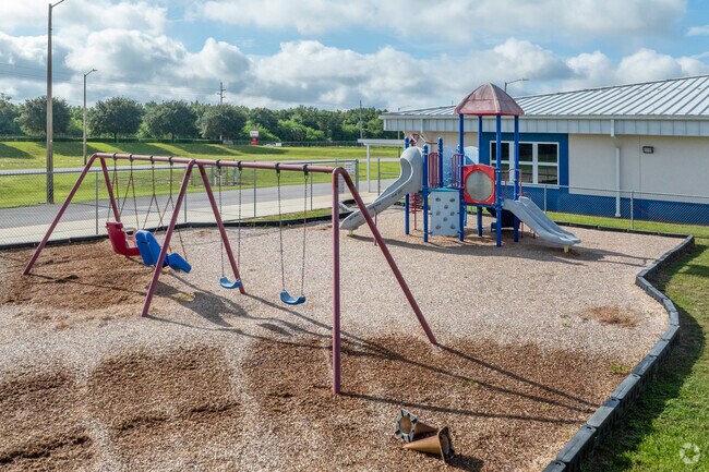Younger Memorial Elementary School students get swing sets and other playground activities.