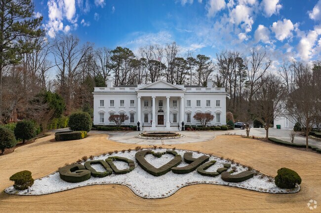 The Atlanta White House, a replica of the U.S. president’s residence, stands as the iconic landmark or Briarcliff Woods symbolizing the area's upscale housing trend.