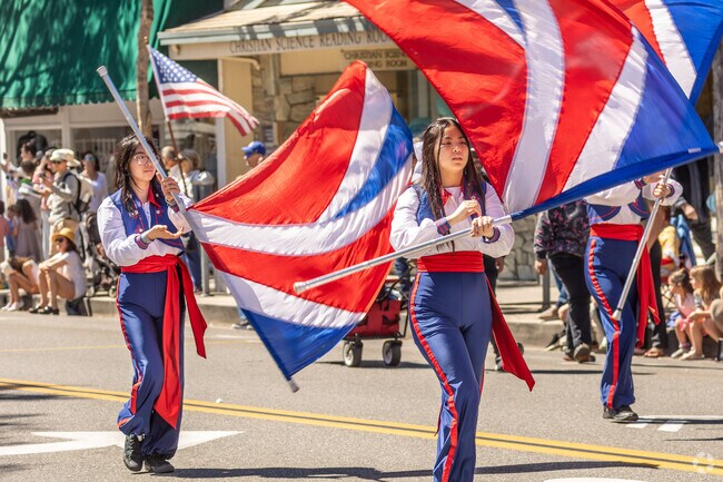 The Patriots Day Parade, held near The Village, features colorful floats, marching bands, veterans’ groups, and scout troops proudly displaying their patriotic spirit.