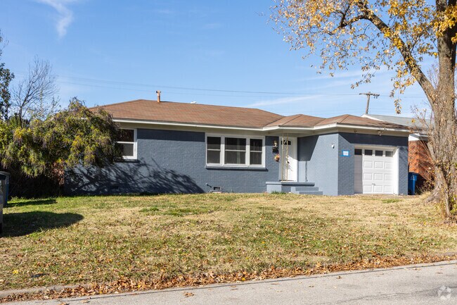 The vibrance of Wagon Wheel is on display with blue painted brick on this ranch-style home.