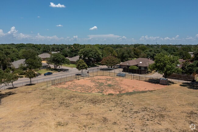 Richardson Aiken Elementary Baseball Field in Lake Highlands is just before the forest.