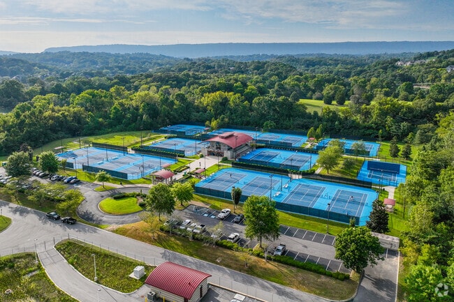 Lupton City visitors 
can play tennis with a view at Rivermont Champions Club.