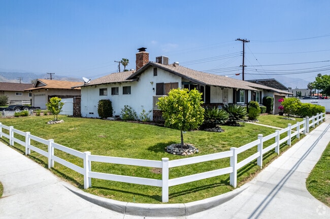 This ranch home in Barton has a corner lot with a white picket fence.