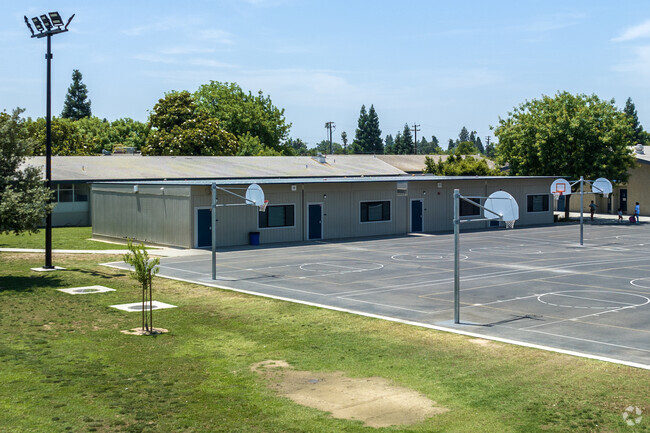 Students play basketball at Jackson Elementary School in Sanger.