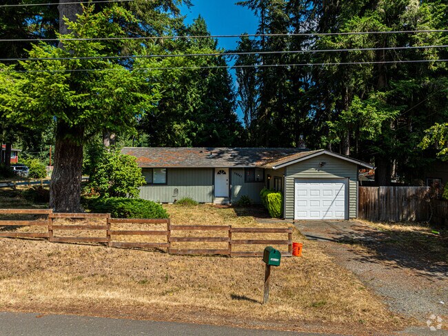 This cute rancher home has its own single car garage and nice yard fencing.