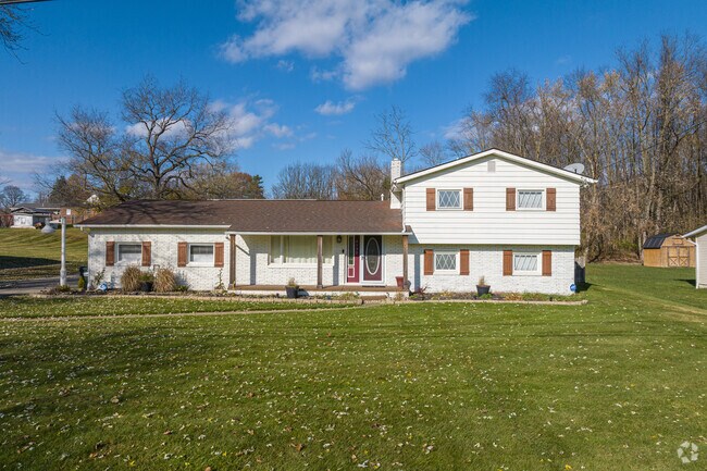 This home in Canton Outskirts features a unique mix of both a ranch-style and Split-Level house.