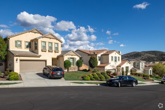 A row of homes under a blue sky is seen in Sycamore Creek.