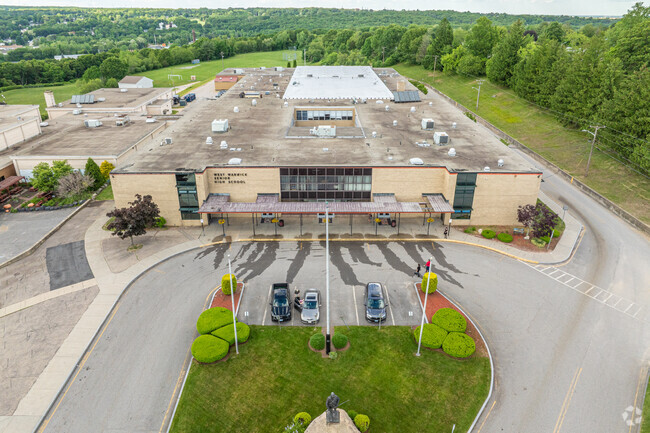 Students graduate up to West Warwick High School.