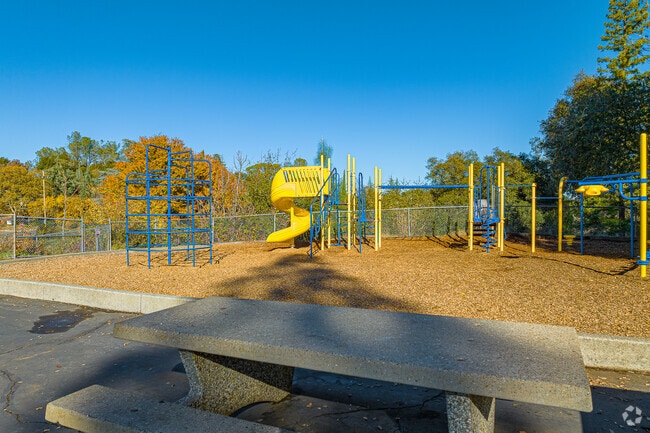 Students play tag on the play structure of Alta Vista Community Charter.