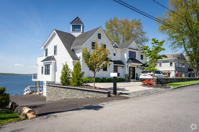 A stunning contemporary house with a picturesque bay view in the North Tiverton neighborhood.
