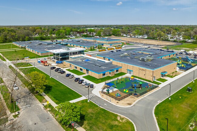 Brownell STEM Academy features a large play area behind the school for student recess.