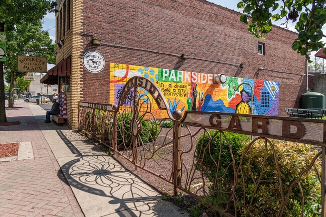 The Learning Garden in Gateway features a large mural showing neighborhood pride.