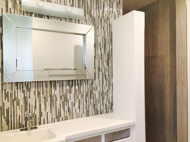 tiled master vanity wall and fixtures