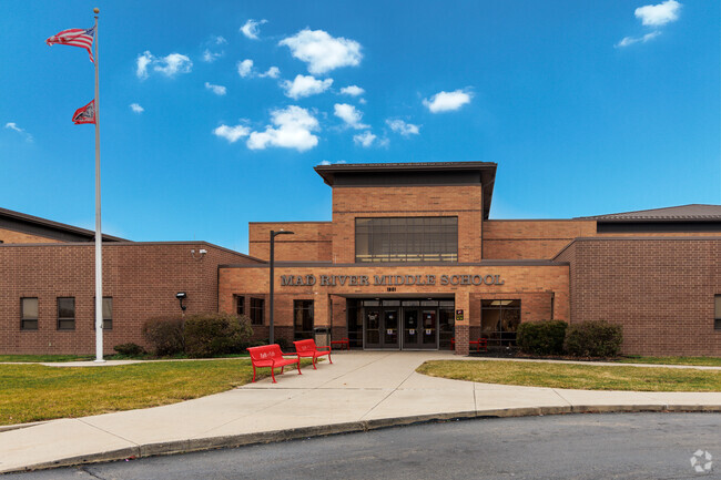 Teachers greet students with smiles at Mad River Middle School.