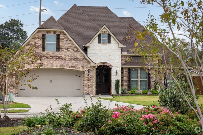A traditional home with tutor inspired architecture found in Groves.