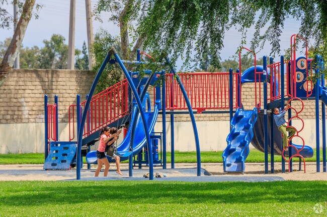 Playing on the swings at Coolidge Park in Long Beach.
