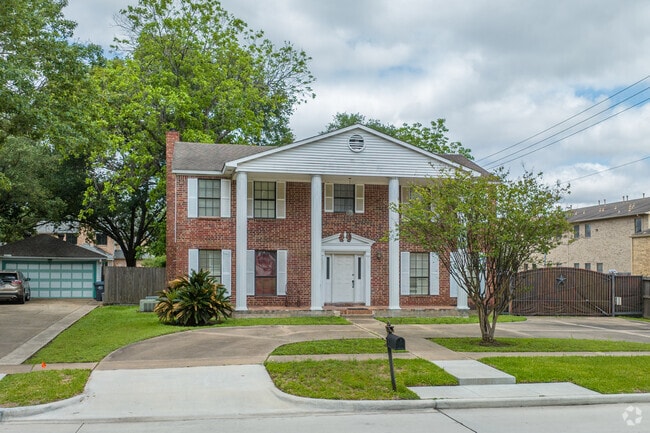 Classical‑style homes feature symmetrical façades in Jersey Village.
