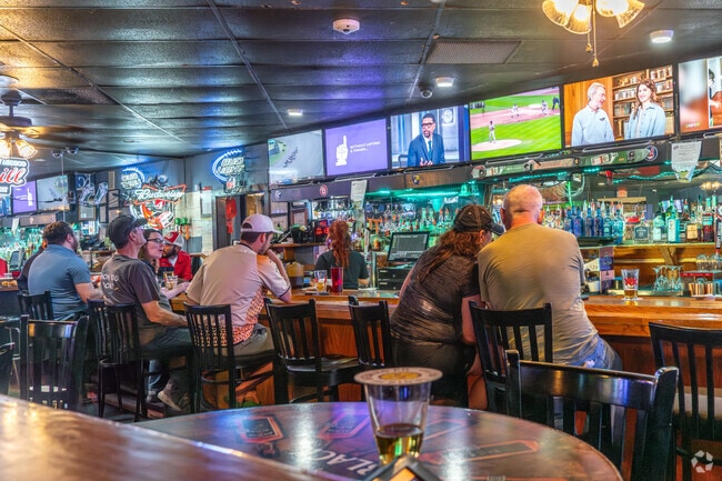 Enjoy catching the game and delicious food at Spectators Sports Bar and Grill near Tanoan Community.