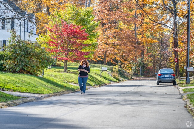 A woman goes for a walk along a level street in the Suncrest neighborhood.