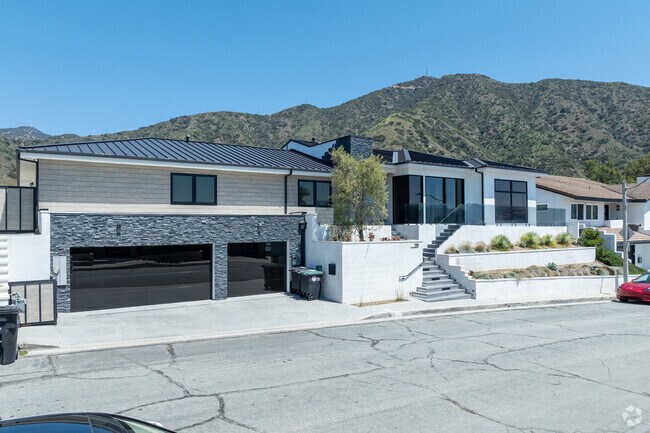 Contemporary ranch homes in Brockmont seamlessly blend mid-century design with modern updates, featuring open-concept layouts, vaulted ceilings, and expansive windows that flood interiors with natural light.