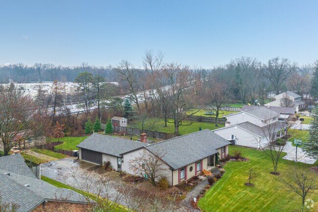 A row of ranch-style homes borders the highway on the west side of Woodhurst.