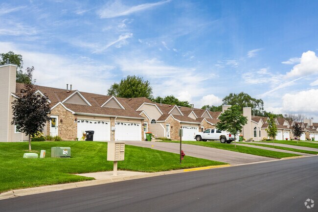 Spring Lake Park townhomes share driveways, and many include private garages.