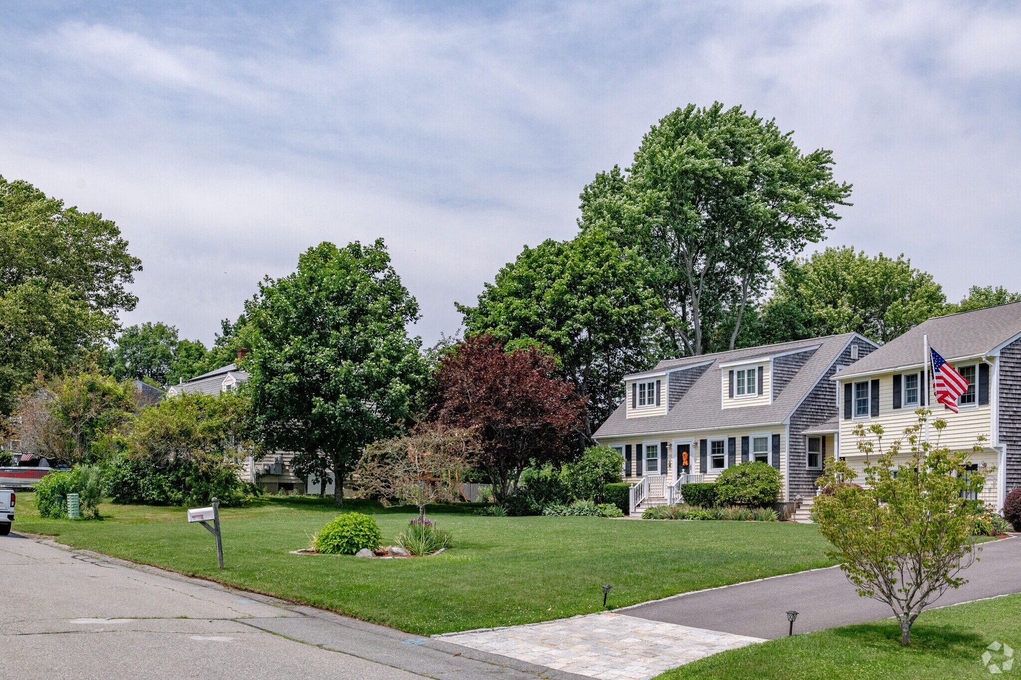 Generous sized homes in the Bristol Ferry neighborhood are often on neat tree-lined streets.