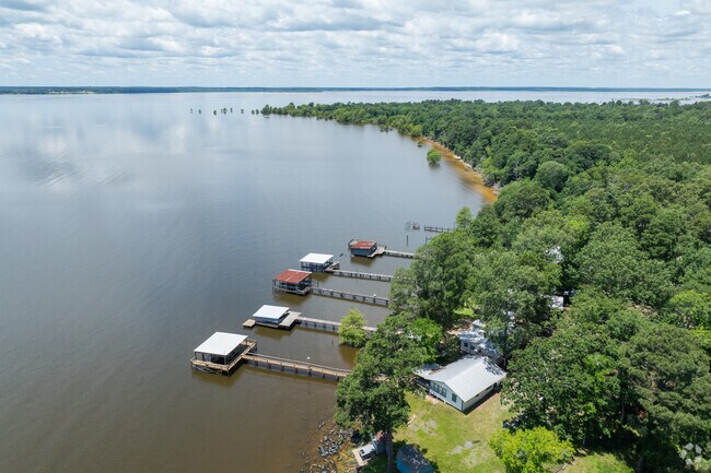Many homes in Hunter-Lula have wooden docks stretching out over calm waters.