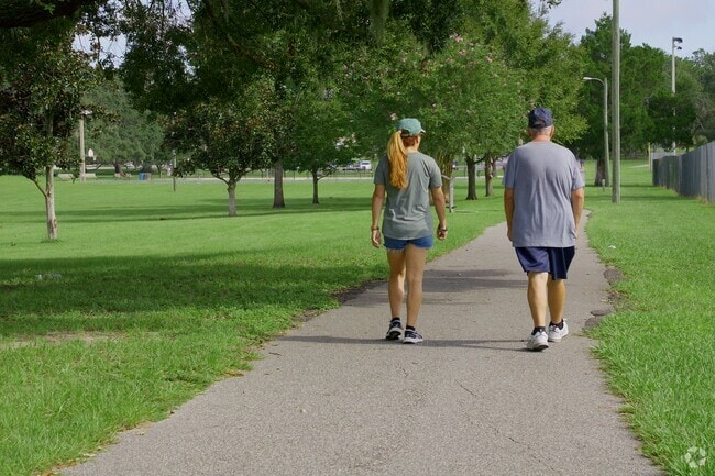A couple enjoying a walk in Jervey Gantt Park in SE Ocala.
