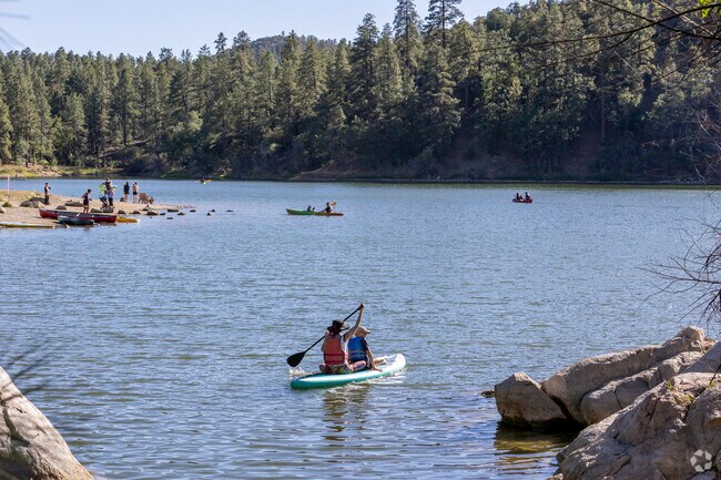 A mom paddles with her son at Prescott’s Goldwater Lake.