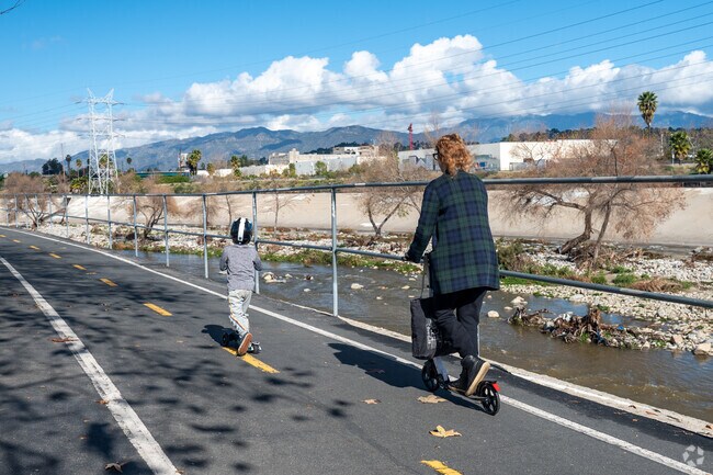 Ride a scooter with your kid along the river at Elysian Valley.